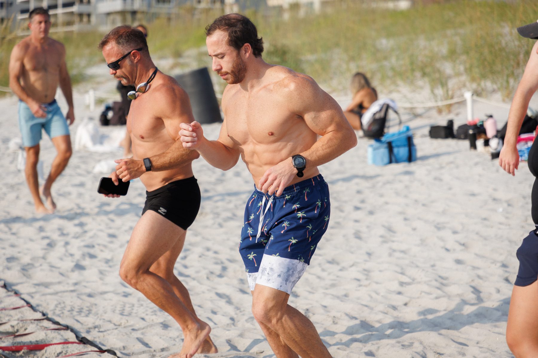 Chris Ochs running on the beach at a Jacksonville race.